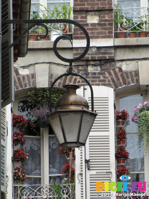 SX19825 Lantern with flowers on balcony in background, Troyes, France